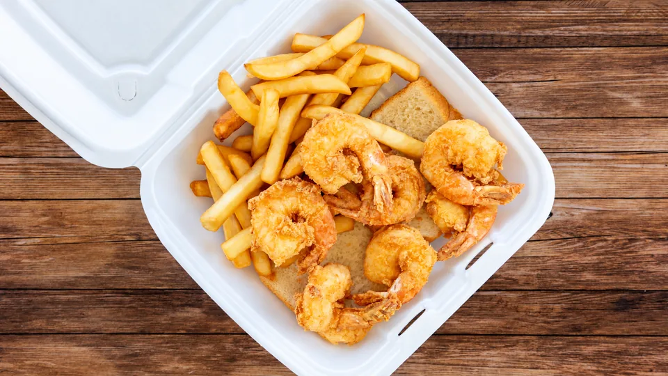 Breaded shrimp with fries and bread