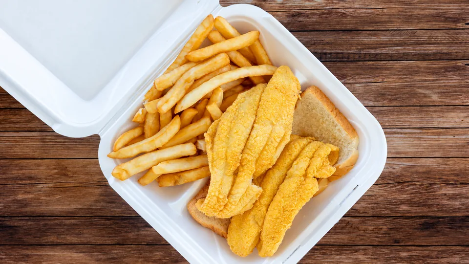 Breaded fish strips with fries